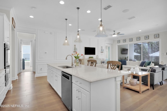 88 Village Grande Dr, Ponte Vedra, FL 32081 - kitchen featuring visible vents, a sink, appliances with stainless steel finishes, a decorative wall, and open floor plan