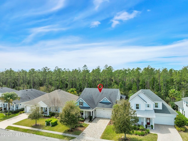 88 Village Grande Dr, Ponte Vedra, FL 32081 - aerial view featuring a wooded view