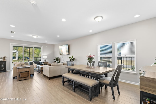dining space featuring a wealth of natural light, visible vents, recessed lighting, and light wood finished floors