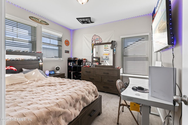 bedroom featuring light colored carpet