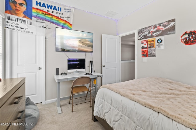 carpeted bedroom featuring baseboards