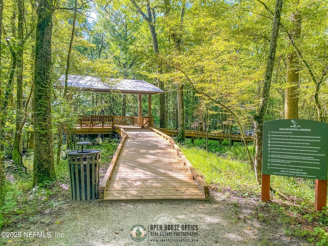 view of property's community with a forest view