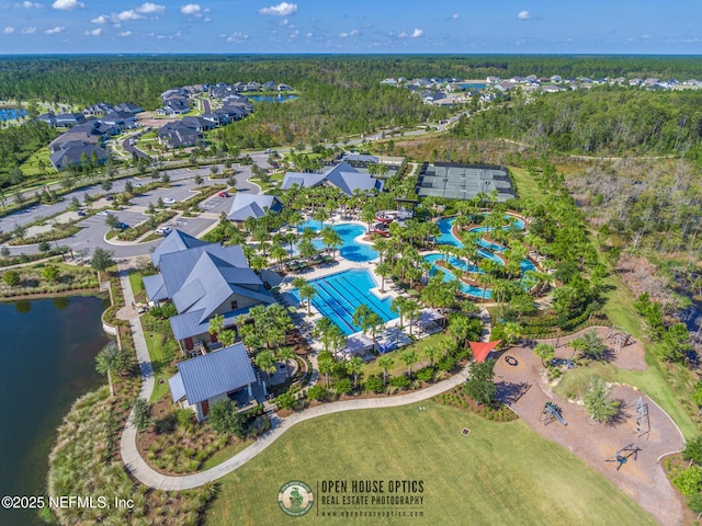 bird's eye view with a forest view and a water view