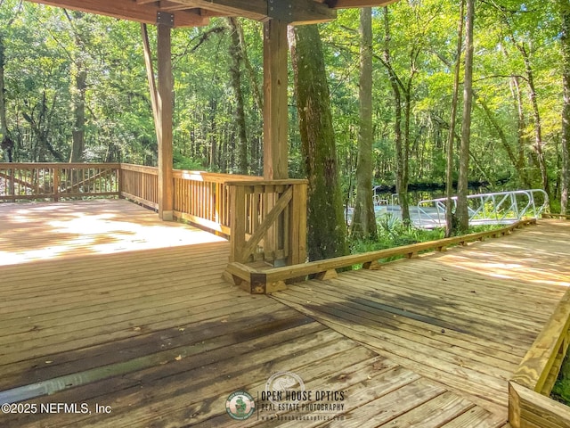 deck featuring a wooded view