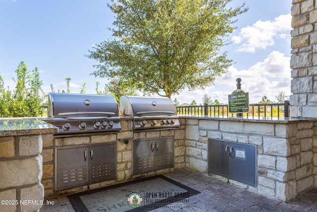 view of patio featuring a grill and exterior kitchen