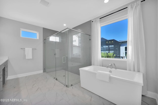 bathroom featuring visible vents, baseboards, a stall shower, a freestanding tub, and marble finish floor