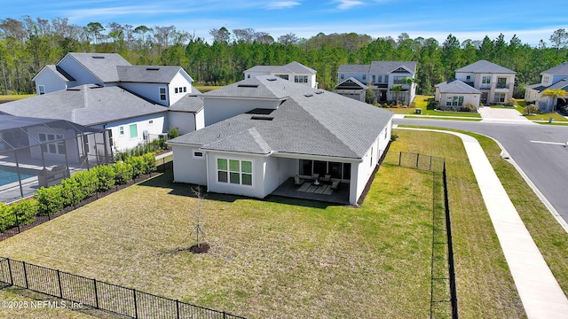 birds eye view of property with a residential view