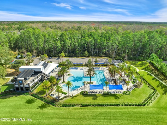 birds eye view of property with a forest view