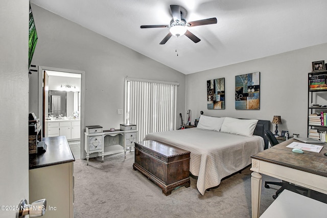 bedroom featuring connected bathroom, light carpet, lofted ceiling, and ceiling fan