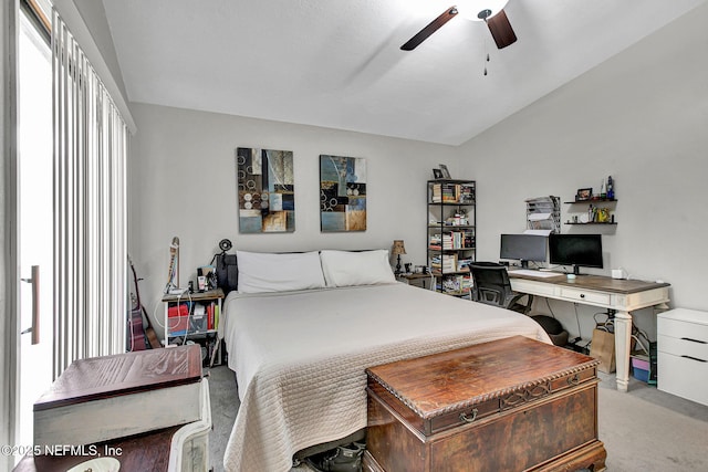 bedroom featuring lofted ceiling, carpet flooring, and a ceiling fan