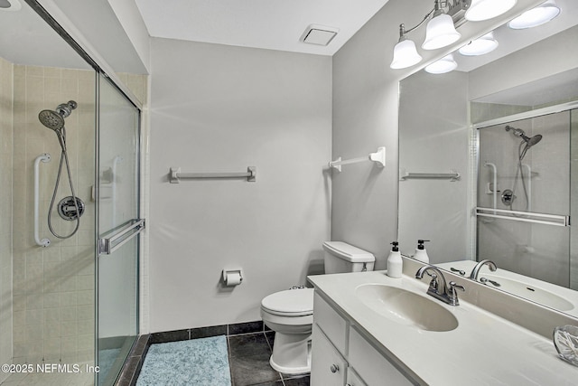 full bathroom featuring baseboards, toilet, a stall shower, tile patterned floors, and vanity