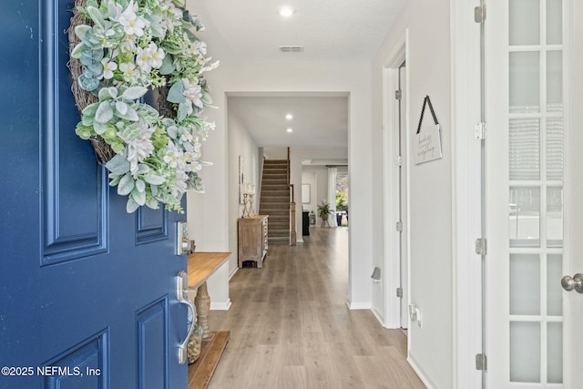 entrance foyer featuring stairs, light wood-style flooring, recessed lighting, and baseboards