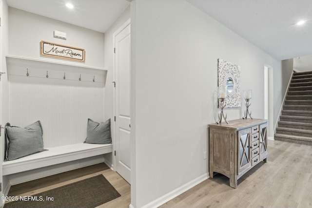 mudroom with recessed lighting, light wood-style flooring, and baseboards