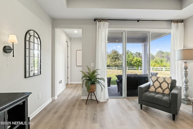 sitting room featuring light wood-style floors and baseboards