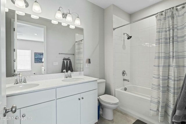 bathroom with a sink, toilet, shower / tub combo, and tile patterned floors