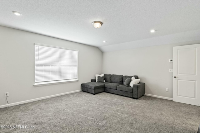 carpeted living area with recessed lighting, a textured ceiling, baseboards, and vaulted ceiling