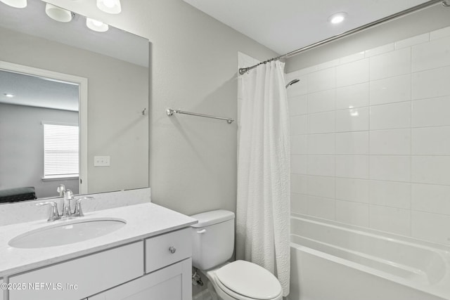 bathroom with vanity, toilet, and shower / bath combo with shower curtain