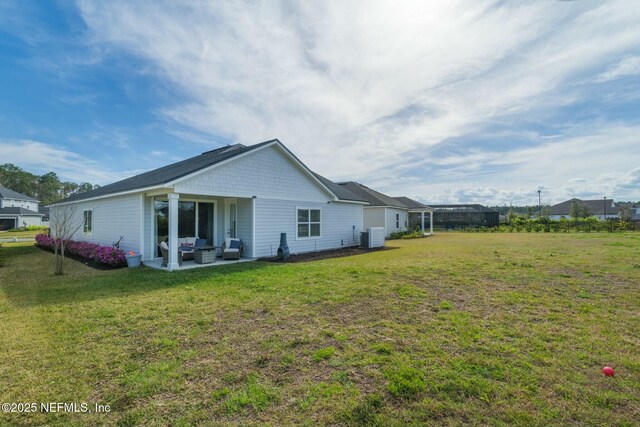 back of house with a patio area, central AC unit, a lawn, and outdoor lounge area