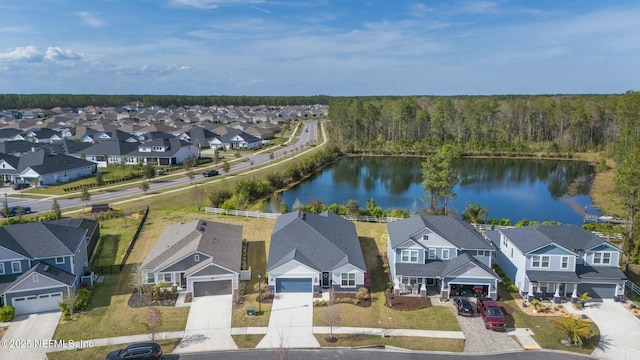 aerial view with a residential view and a water view