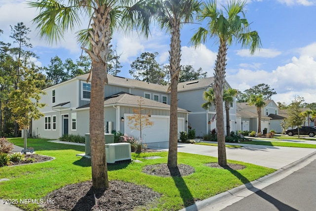 view of property featuring a front yard, central AC unit, driveway, a garage, and a residential view