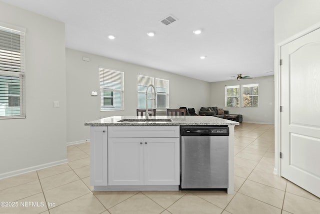 kitchen with a sink, stainless steel dishwasher, a ceiling fan, and light tile patterned floors