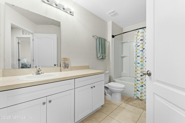 bathroom with vanity, tile patterned flooring, shower / tub combo, a textured ceiling, and toilet