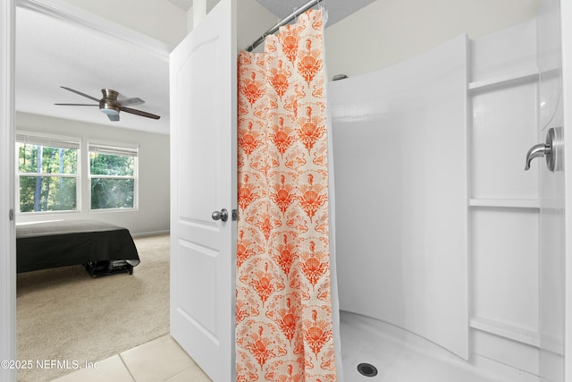 full bathroom featuring tile patterned flooring, a shower with curtain, and a ceiling fan