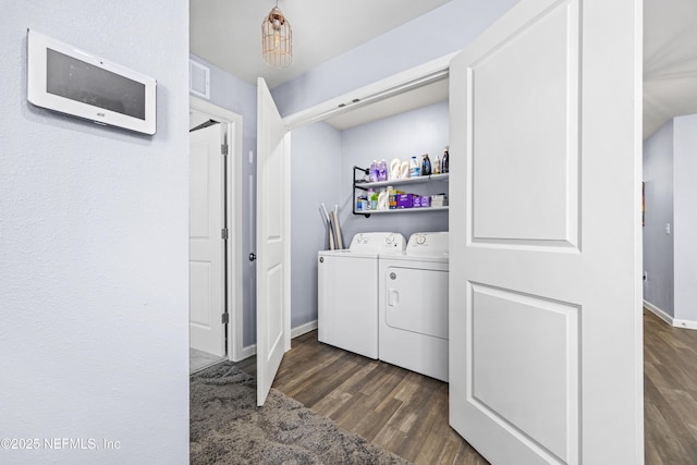 laundry area with visible vents, baseboards, dark wood finished floors, laundry area, and separate washer and dryer