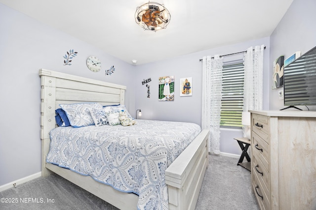 bedroom featuring carpet flooring and baseboards