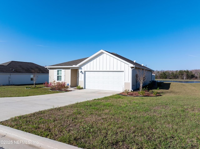 view of front of property with an attached garage, board and batten siding, concrete driveway, and a front yard