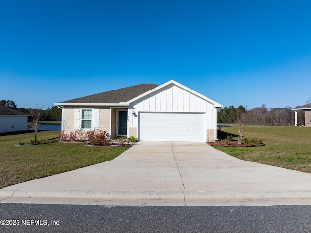 view of front of home featuring a front lawn, an attached garage, board and batten siding, and driveway