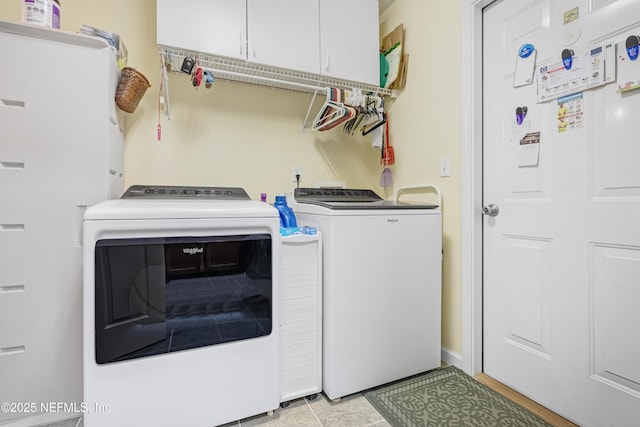 laundry area with cabinet space and washing machine and dryer