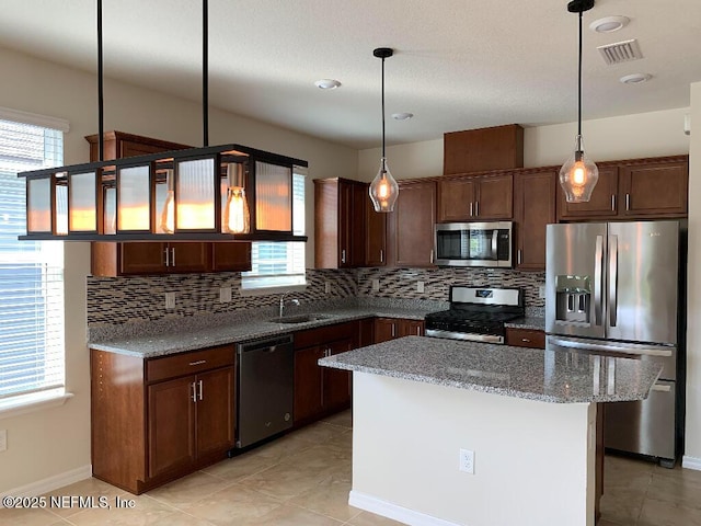 kitchen featuring visible vents, plenty of natural light, appliances with stainless steel finishes, and a sink