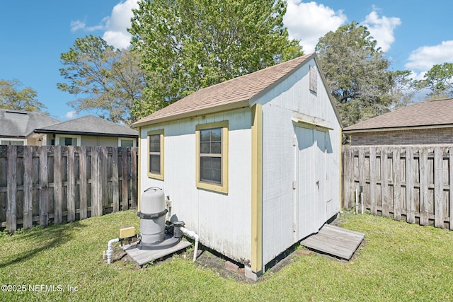 view of shed with a fenced backyard