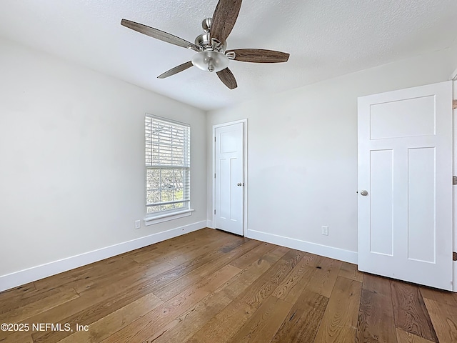 31 Lewis Blvd, Saint Augustine, FL 32084 - spare room with a textured ceiling, dark wood-style floors, baseboards, and ceiling fan