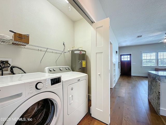 31 Lewis Blvd, Saint Augustine, FL 32084 - clothes washing area featuring dark wood finished floors, laundry area, water heater, a textured ceiling, and washing machine and dryer