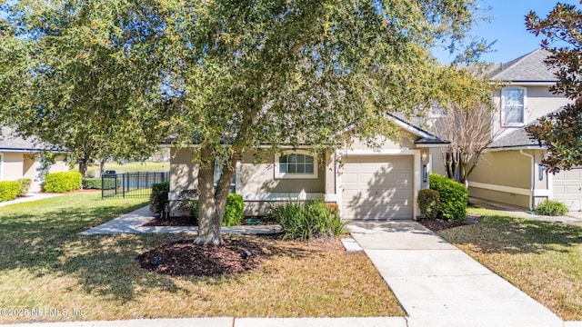 obstructed view of property featuring stucco siding, a front lawn, fence, concrete driveway, and a garage