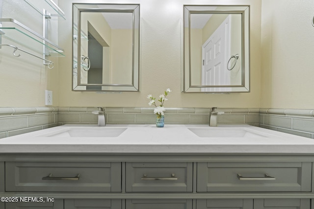 bathroom featuring a sink and double vanity