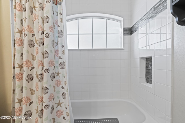 full bathroom with shower / bath combo with shower curtain