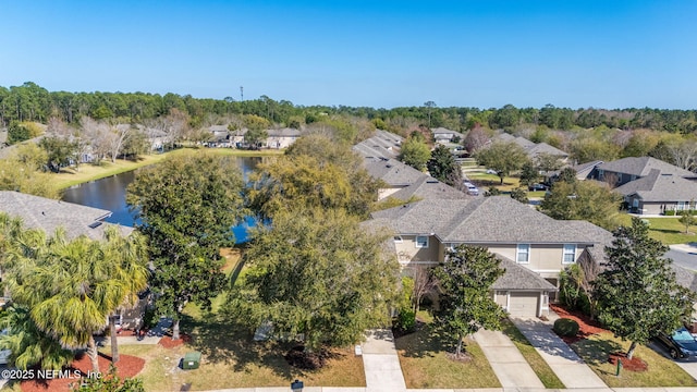 birds eye view of property featuring a residential view and a water view