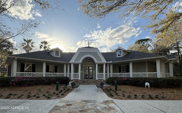 view of front of house featuring covered porch and french doors