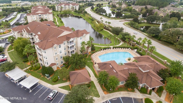 aerial view with a water view and a residential view