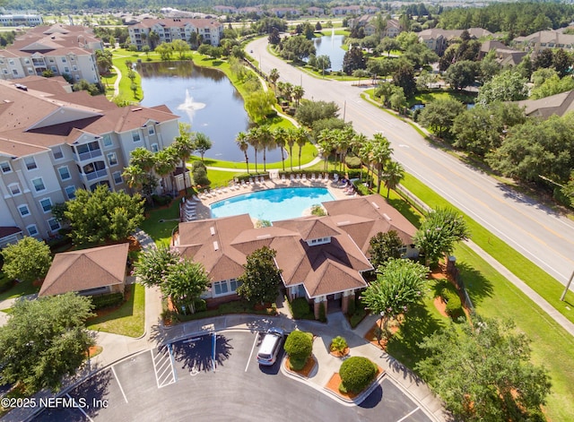 aerial view with a residential view and a water view