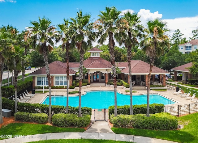 pool featuring a patio area and fence