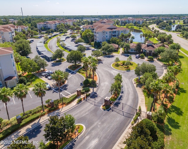 bird's eye view with a residential view and a water view