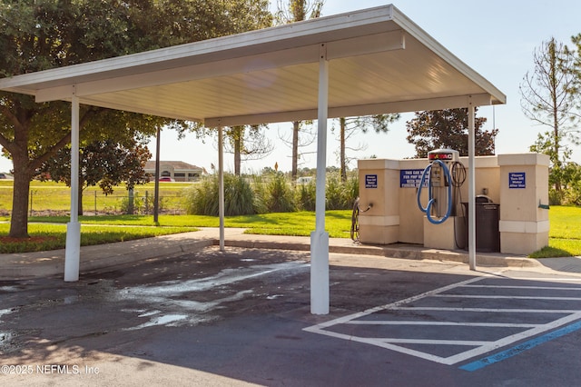 view of partially covered parking lot