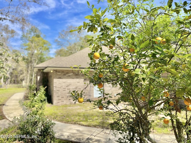 view of property exterior featuring brick siding