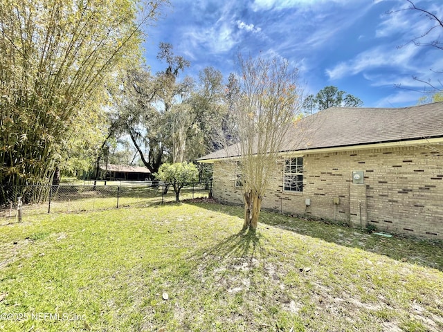 view of yard featuring fence