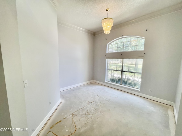 empty room featuring baseboards, concrete floors, a textured ceiling, crown molding, and a notable chandelier