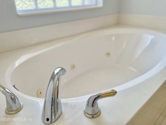 interior details with a sink and a tub with jets